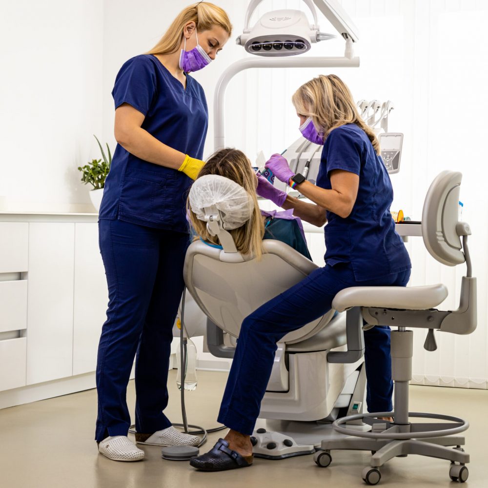 female-dentist-with-assistant-working-in-dental-cl-2025-01-29-08-11-05-utc
