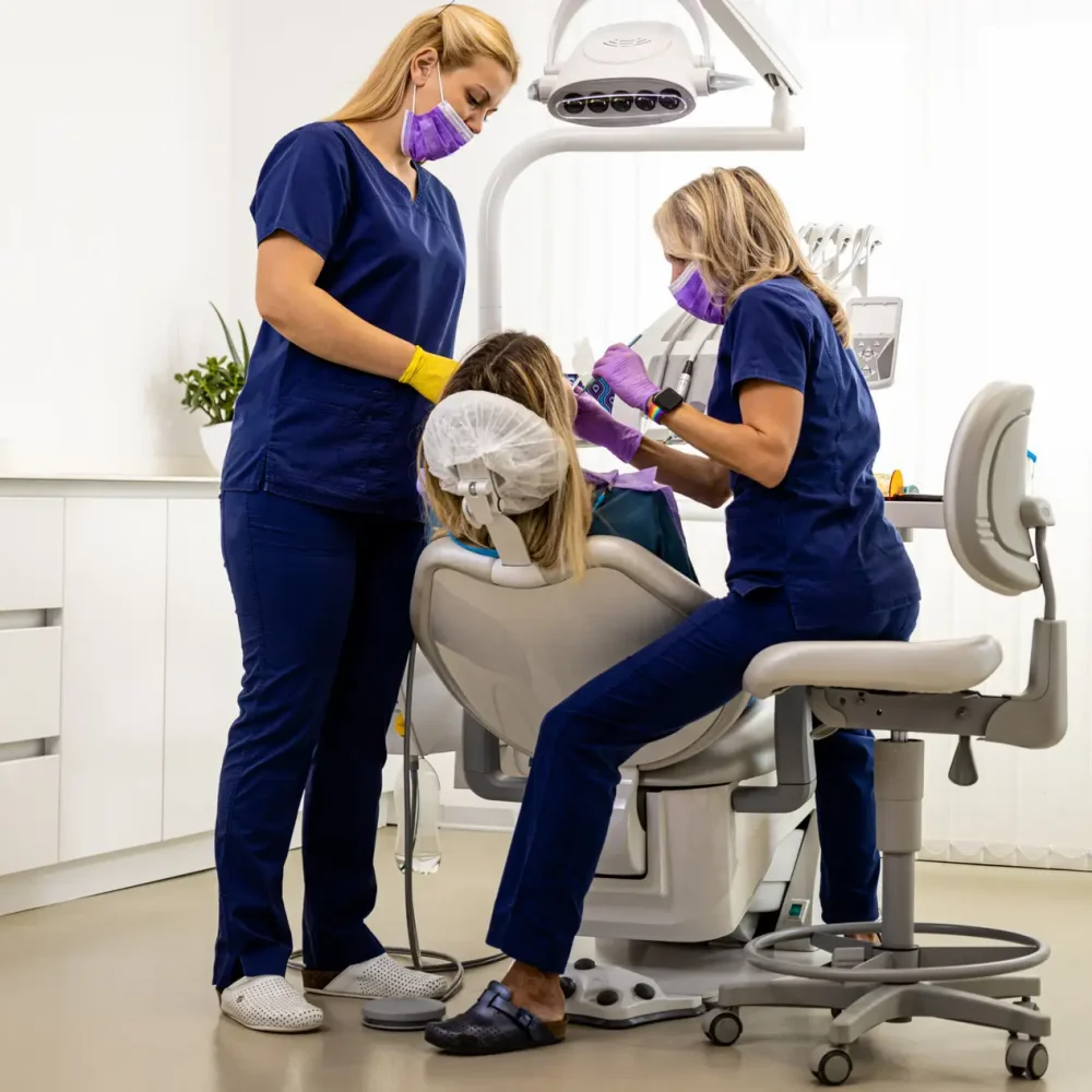 female-dentist-with-assistant-working-in-dental-cl-2025-01-29-08-11-05-utc